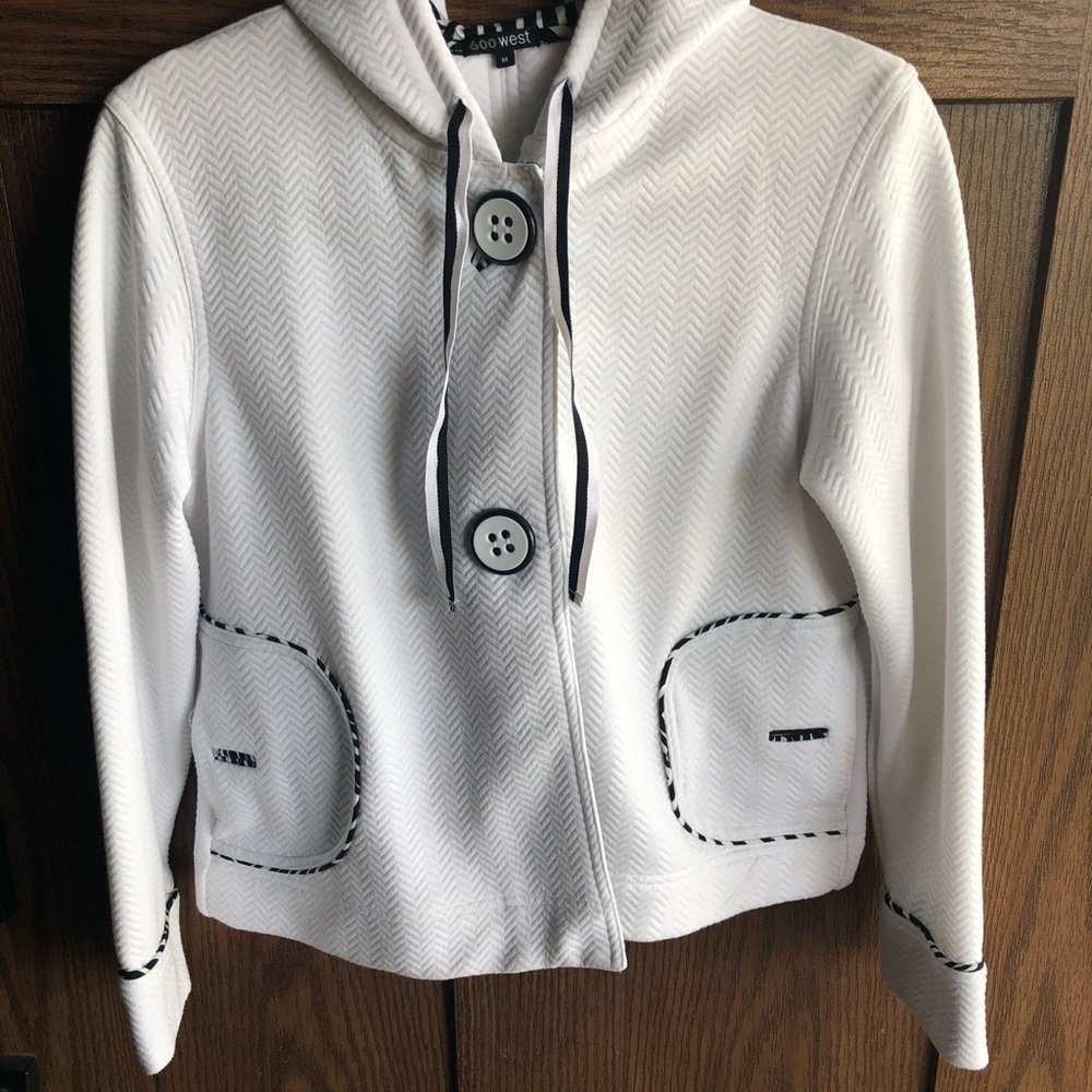 White hooded jacket with black trim. Size M